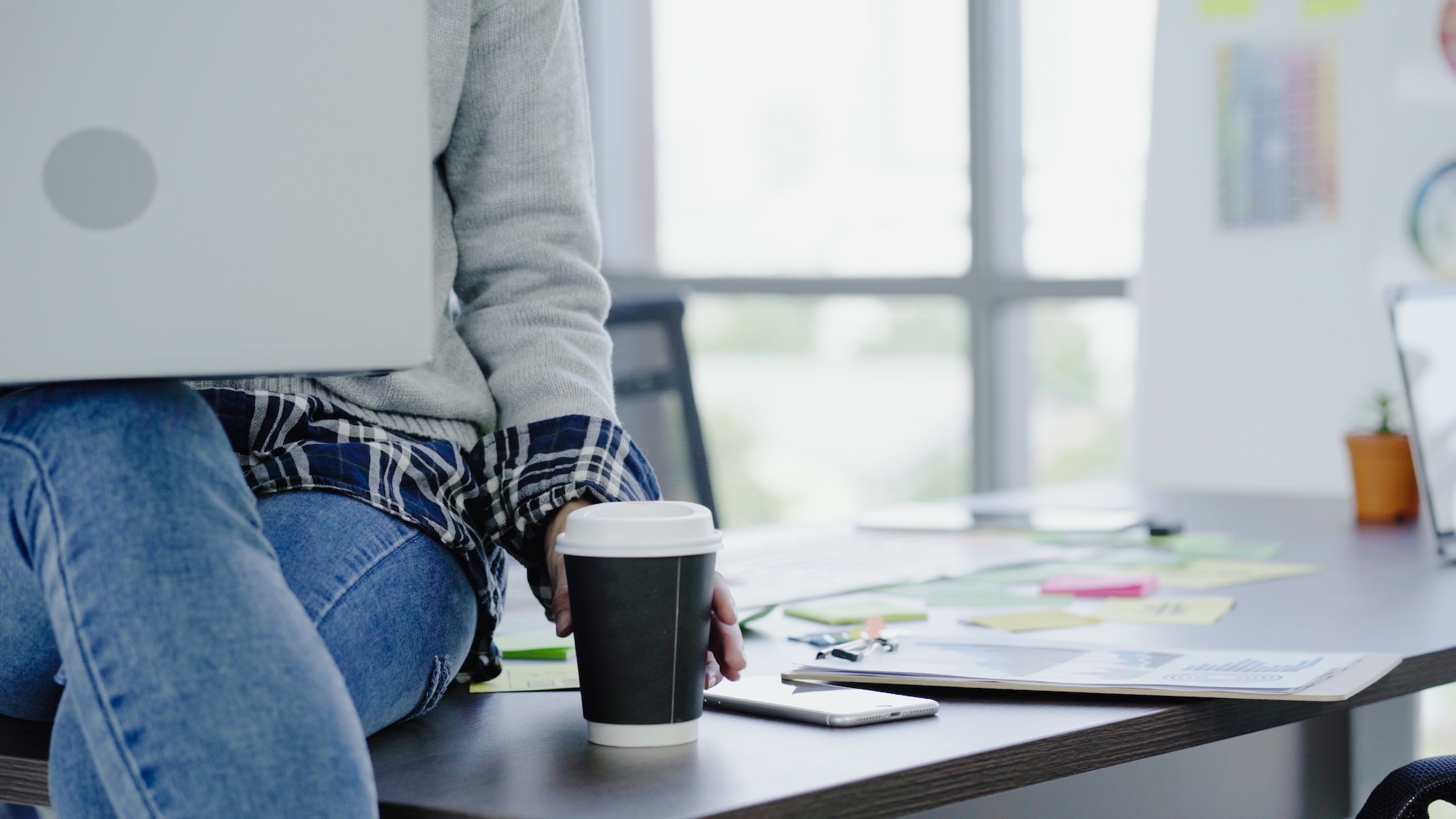 Professional Asian Businesswoman Working At Her Office Via Laptop. Young Asian Female Manager Using Portable Computer Device And Drinking Coffee Cup While Sitting At Modern Workplace.